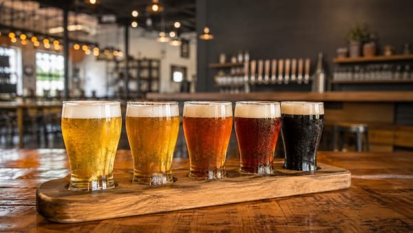 Craft beer glasses lined up inside ETX Brewing Co. in downtown Tyler